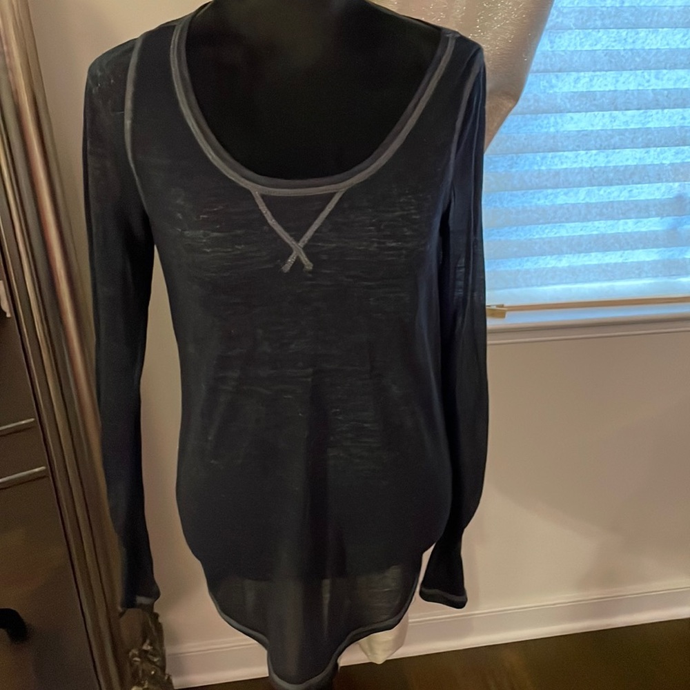 Comfortable semi-sheer long sleeve top. Dark navy blue